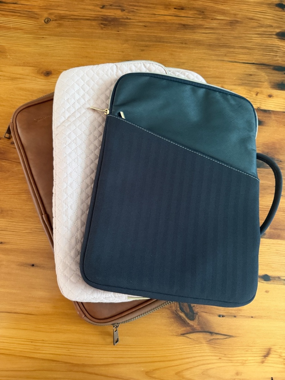 3 Laptop Sleeves - Brown, Pink, and  Black.